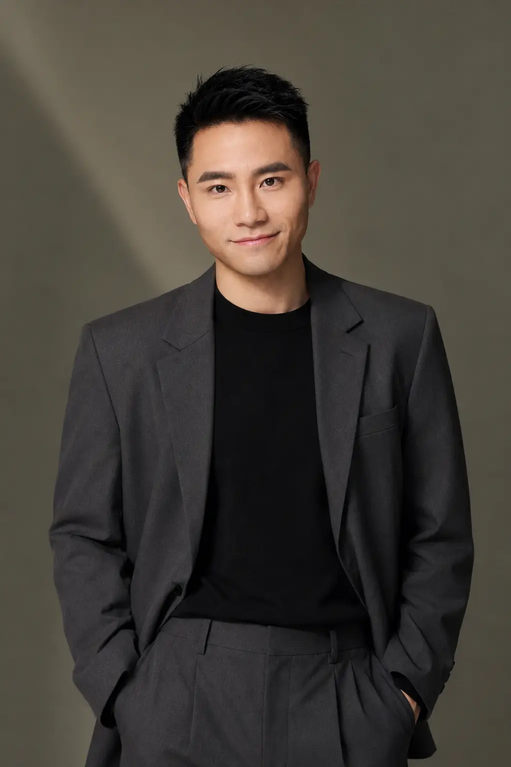 Bobby Wu wearing a charcoal suit